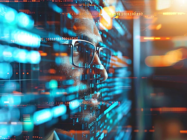 Man standing behind a colourful ray of numbers